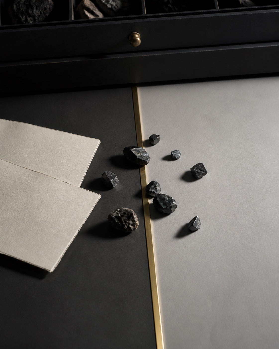 Angular mineral fragments cross a brass boundary for The Threshold chapter.